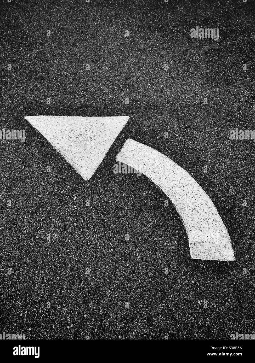 Left turn traffic sign on asphalt pavement - Smartphone Captured Stock Image