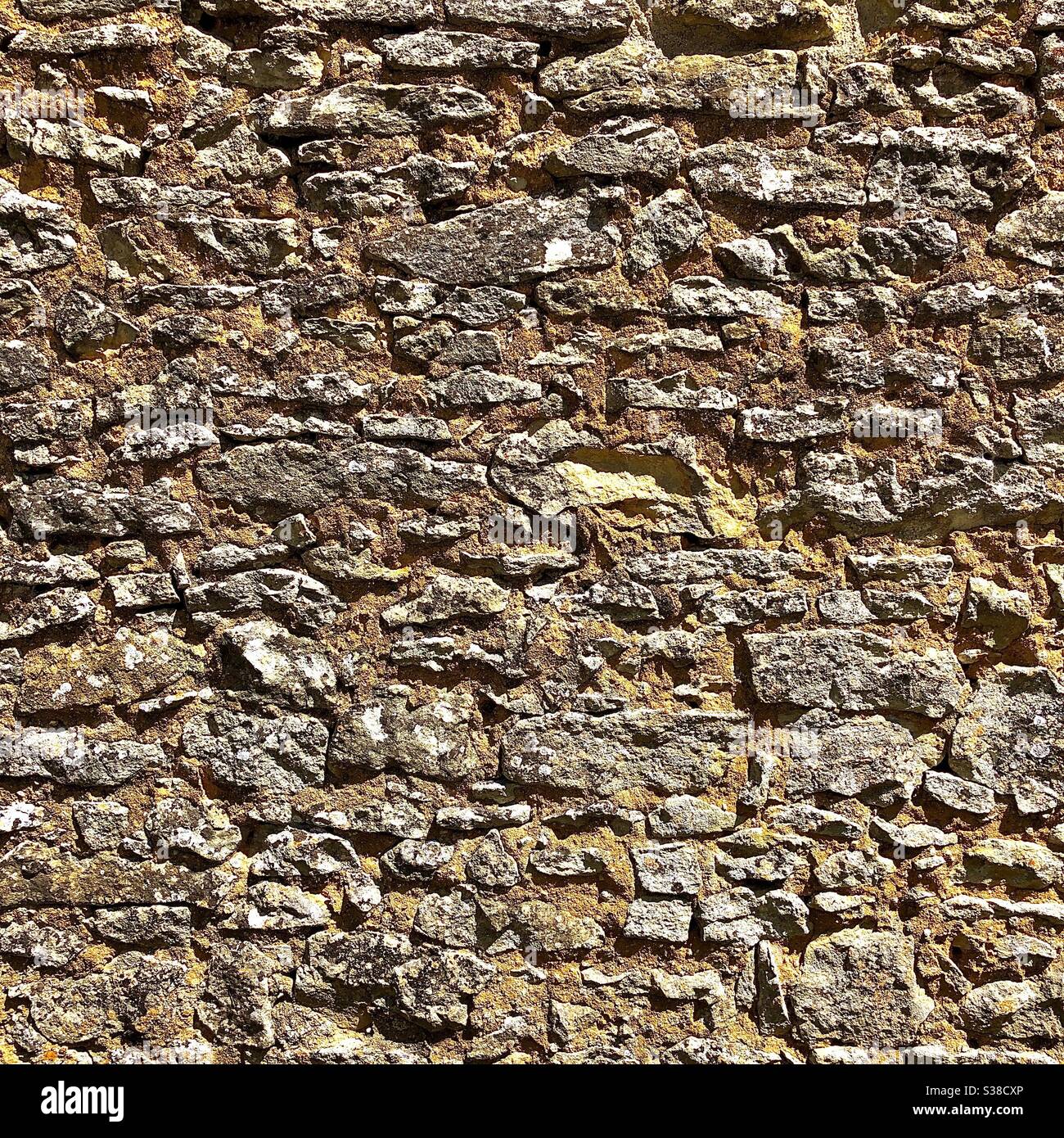 Old stone wall background texture - France. Stock Photo