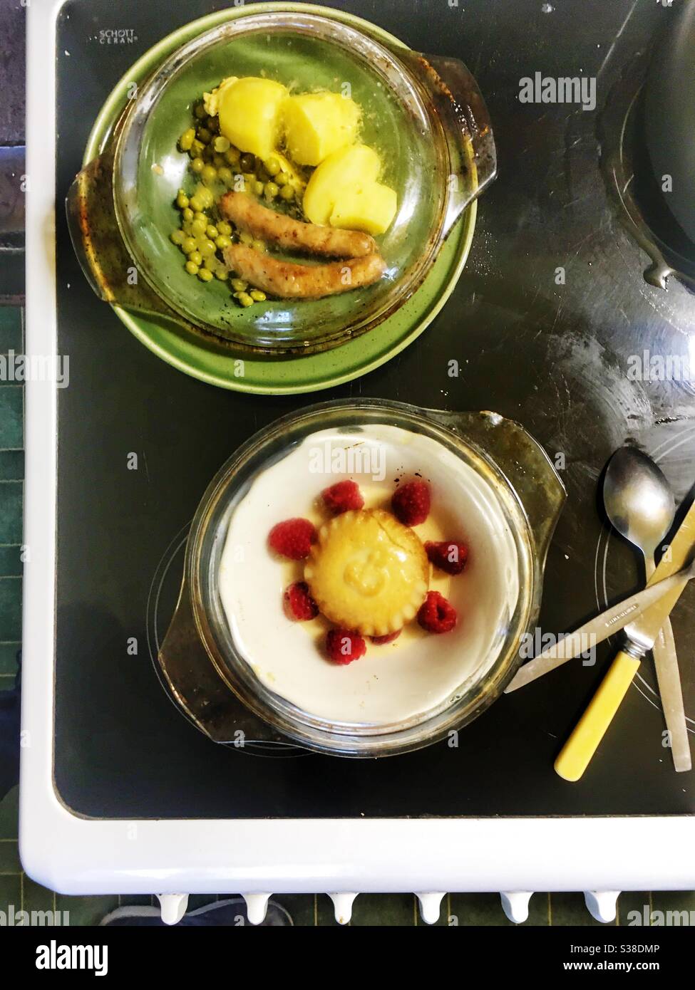 Sausage boiled potatoes and peas with apple pie and raspberries - Smartphone Captured Stock Image