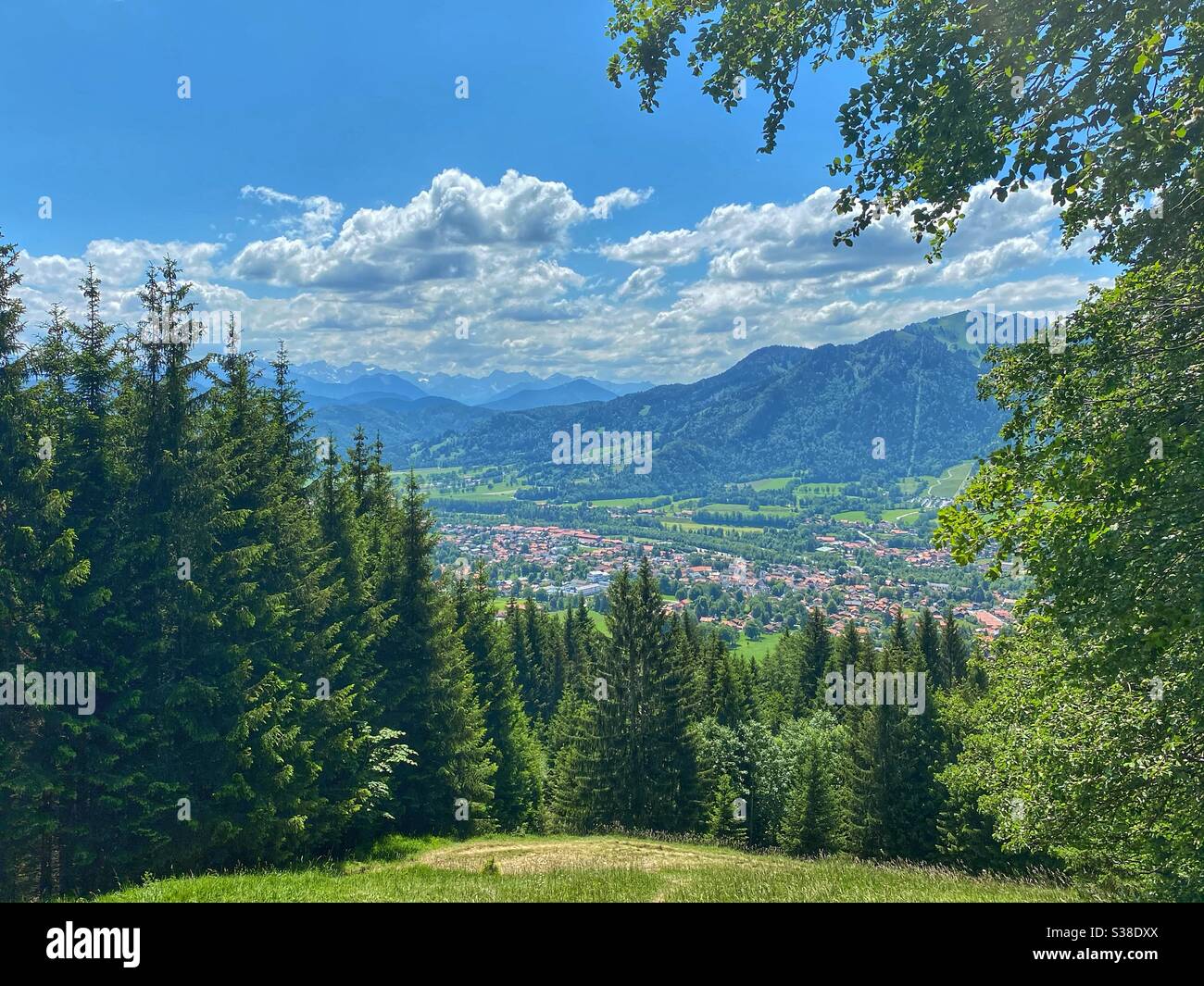 View from Keilkopf mountain (1125m) at Lenggries and alpine peaks. Stock Photo