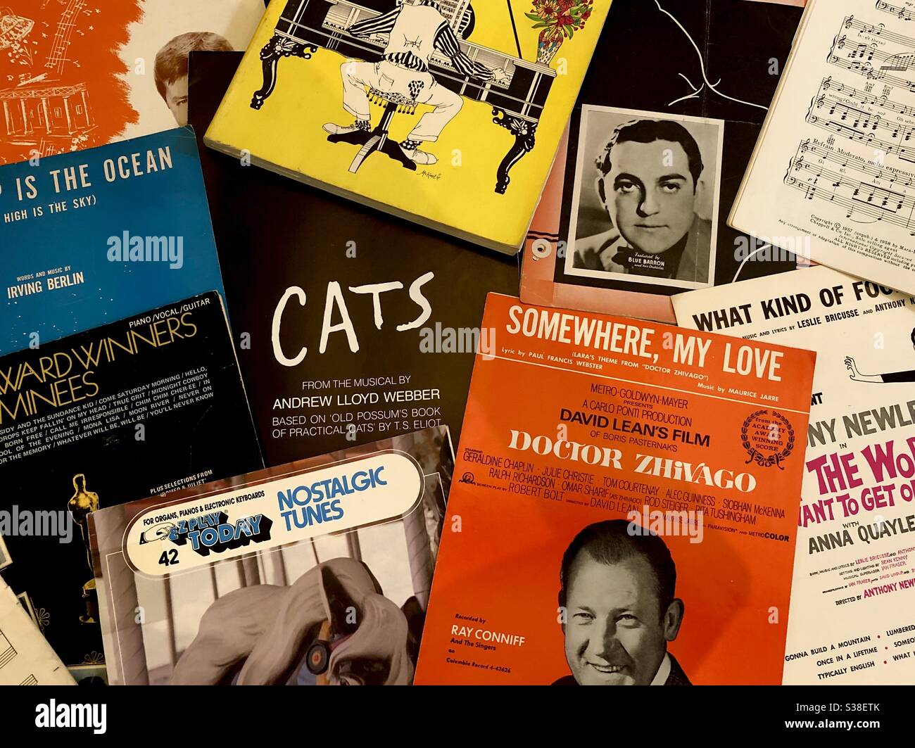 A collage of piano music sheets from Broadway shows and nostalgic tunes. - Smartphone Captured Stock Image