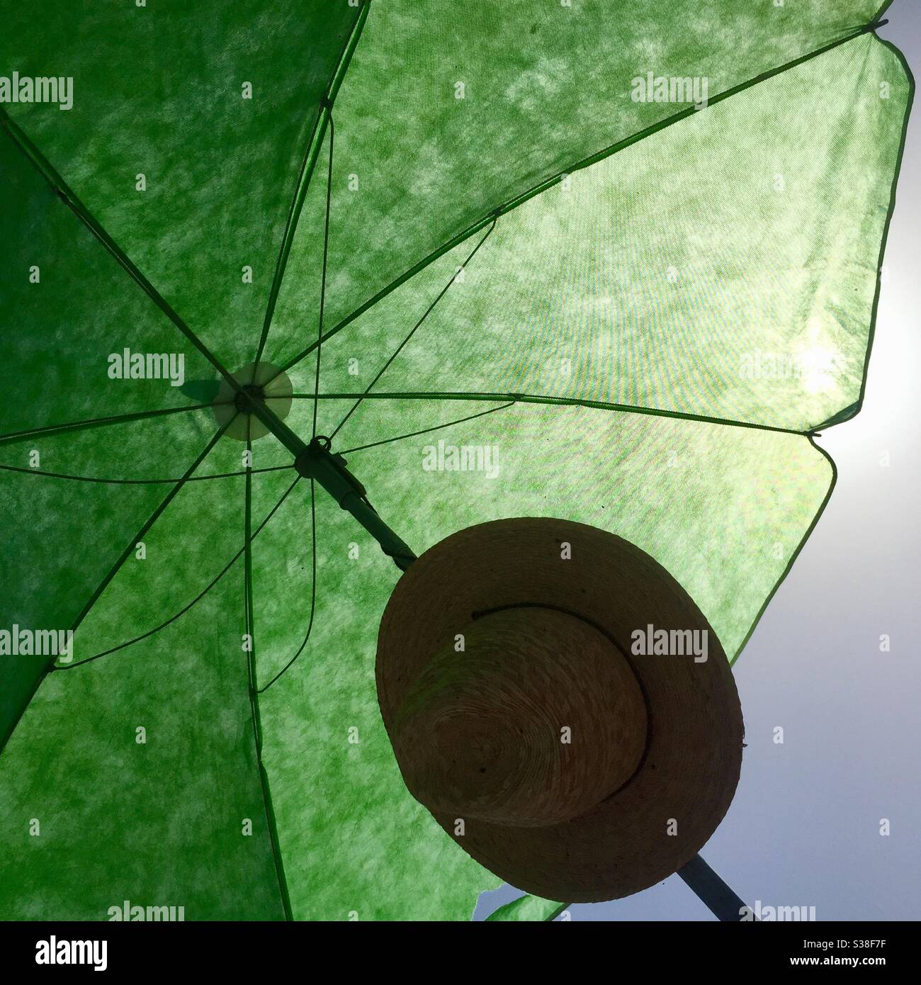 umbrella and hat with backlight Stock Photo