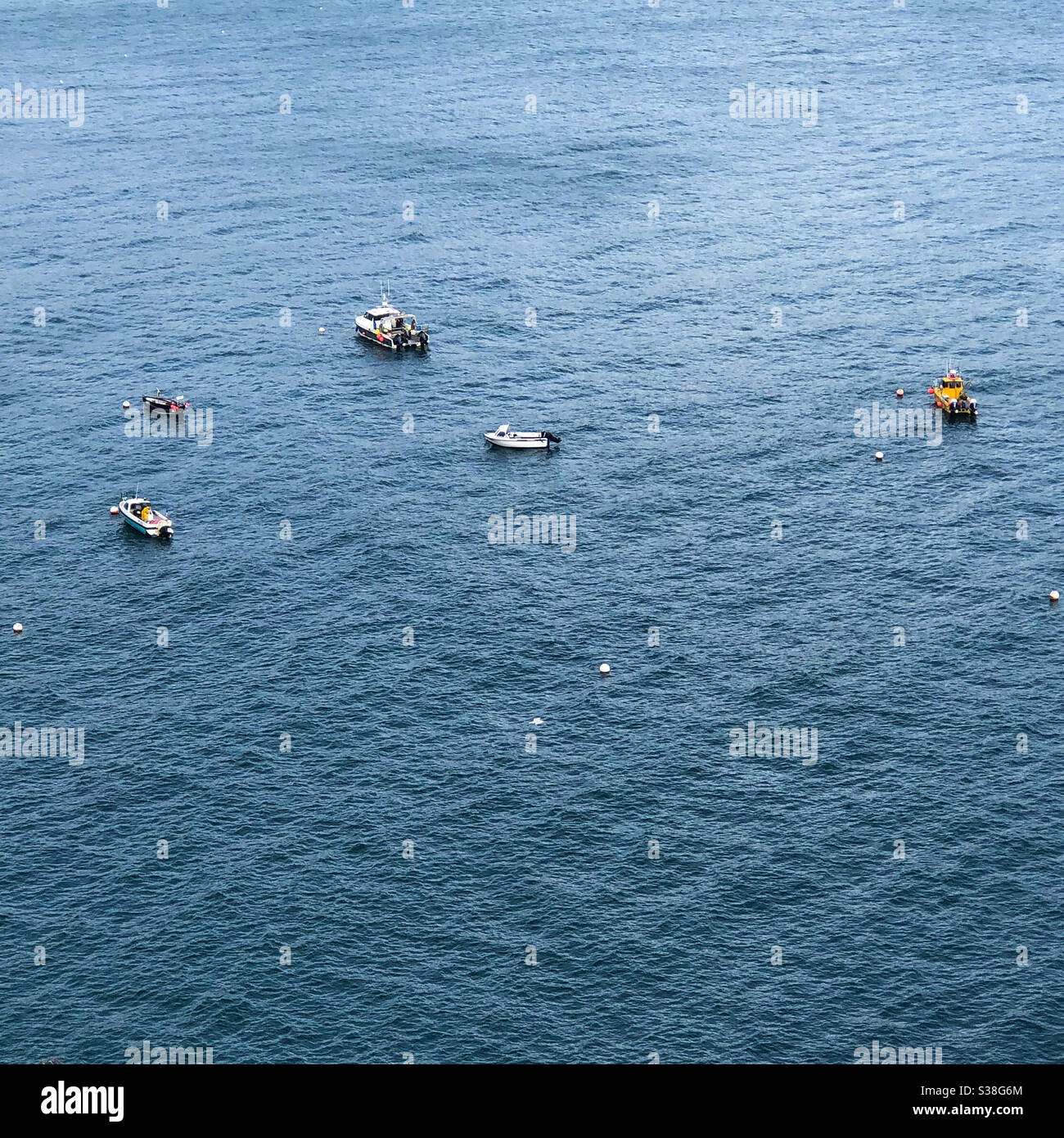 Tiny boats at sea - Smartphone Captured Stock Image