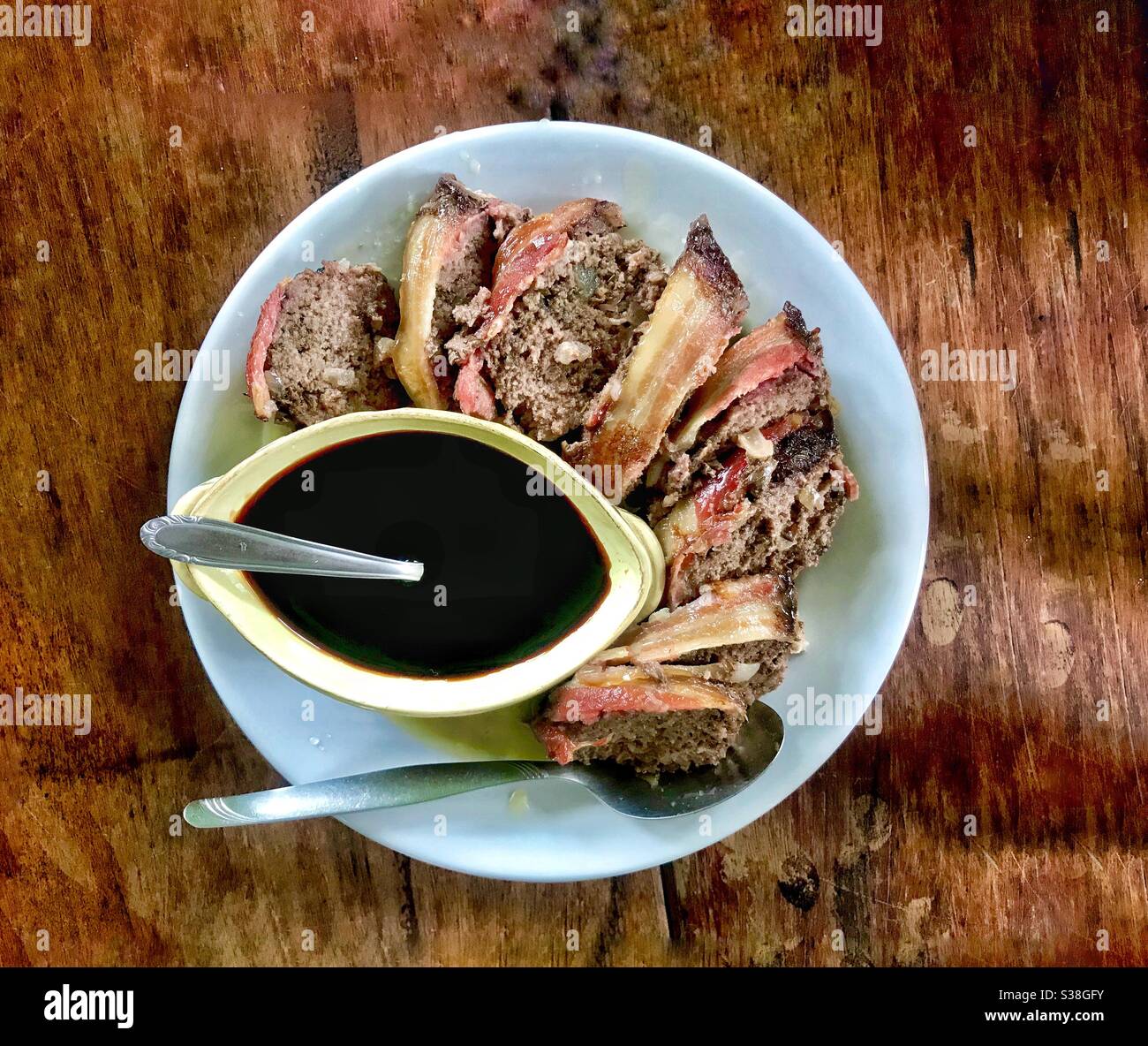 meat loaf stuffed with bacon and sweet and sour honey sauce - Smartphone Captured Stock Image