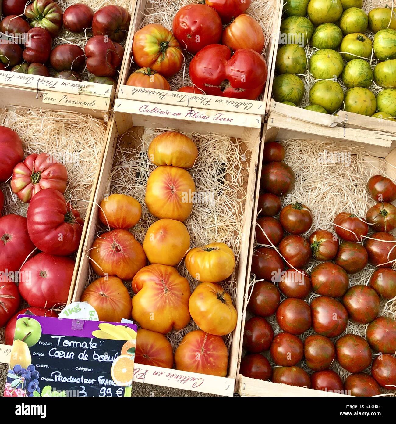 Heritage tomatoes on display outside French village food shop. Stock Photo