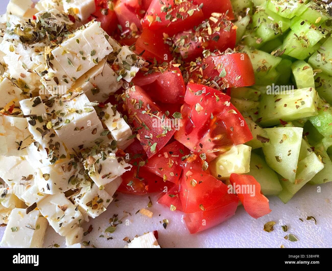 Ingredients chopped for Greek salad, feta cheese, tomato, cucumbers - Smartphone Captured Stock Image