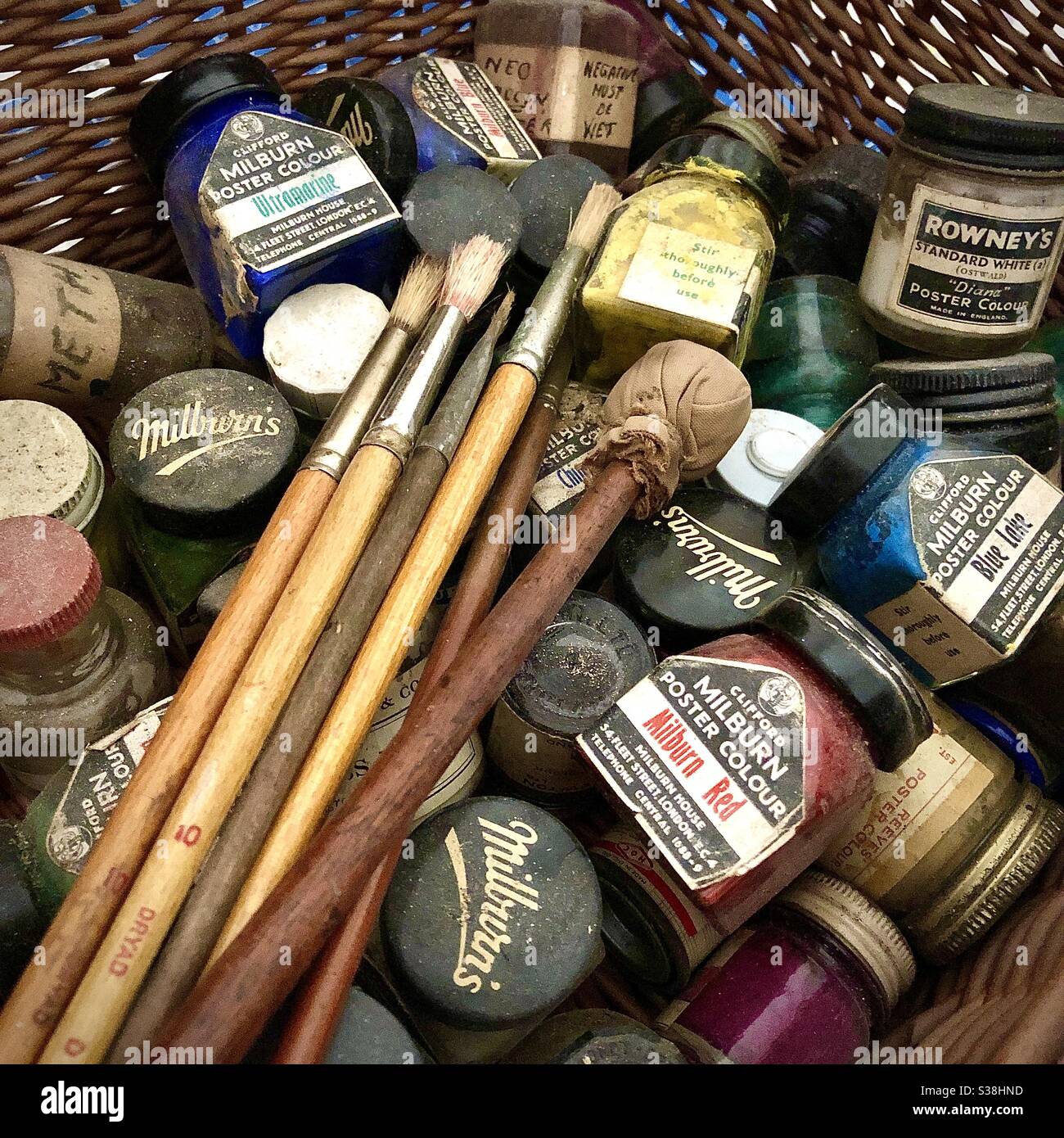 Collection of old Rowney and Milburn bottles of artist’s poster paints and brushes. - Smartphone Captured Stock Image