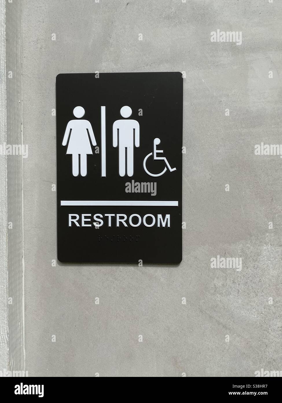 Restroom sign for men, women and handicap on an outside door Stock Photo