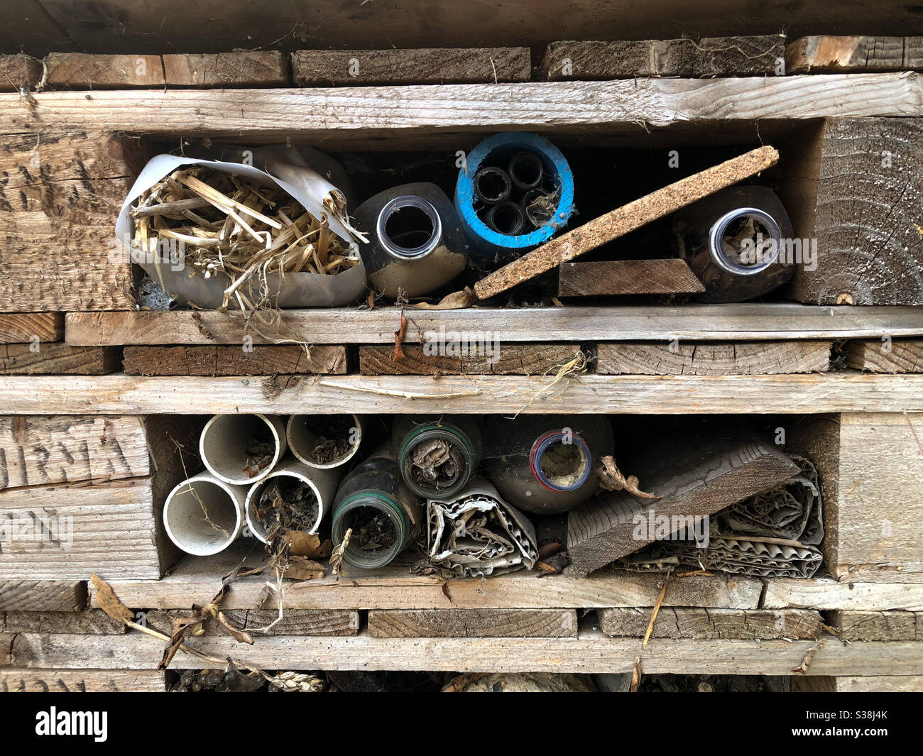 A bug hotel where insects can hibernate or overnight safely. - Smartphone Captured Stock Image