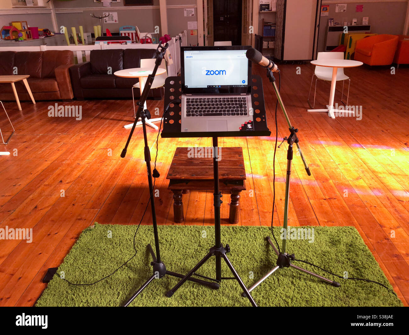 Computer and microphones set up on a church to do a service via video conference. - Smartphone Captured Stock Image