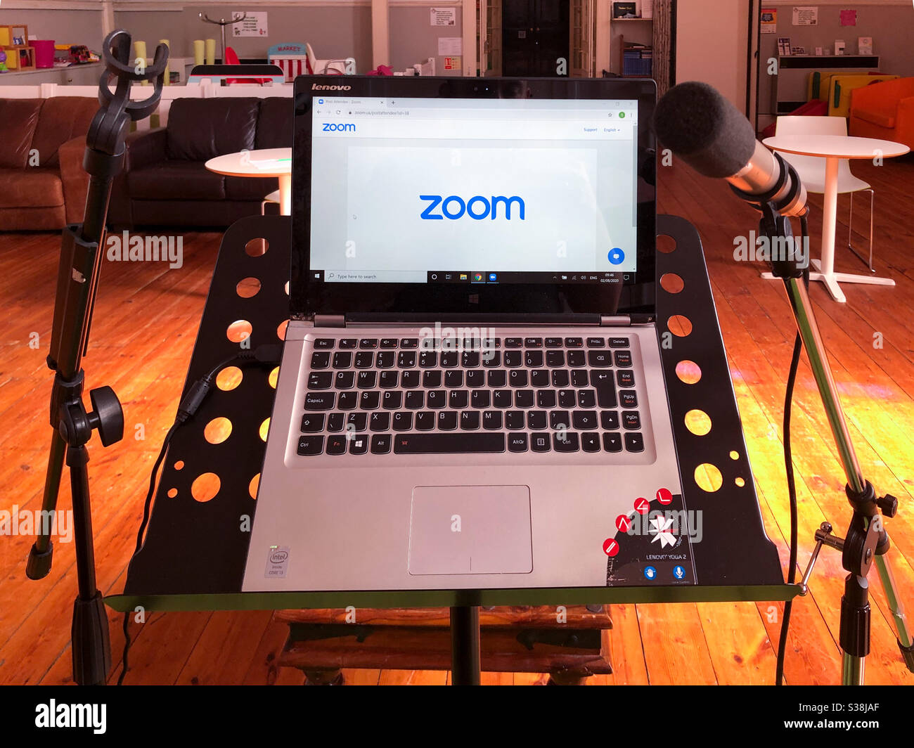 Computer and microphones set up on a church to do a service via video conference. - Smartphone Captured Stock Image