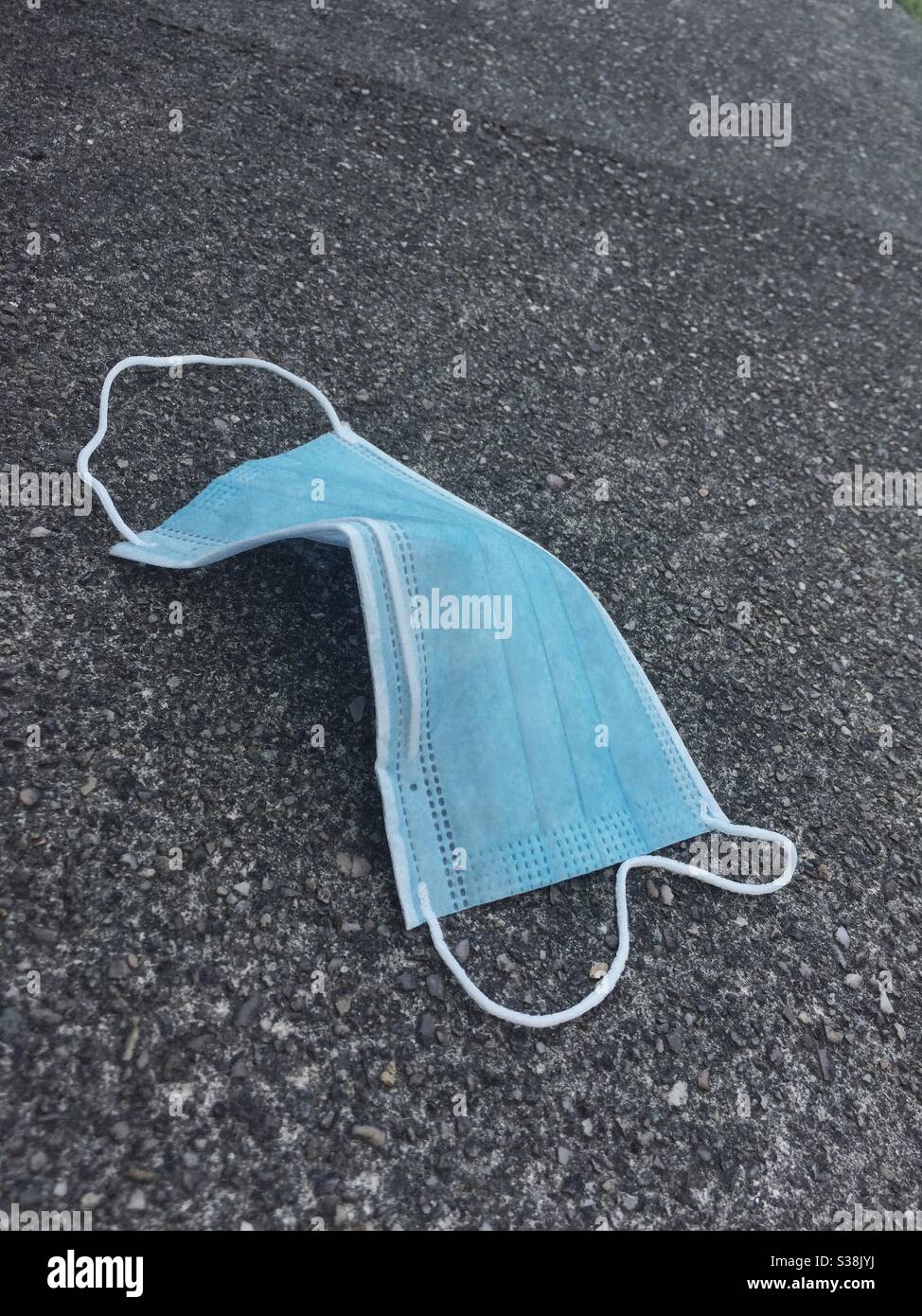 Disposable mask on the floor. - Smartphone Captured Stock Image