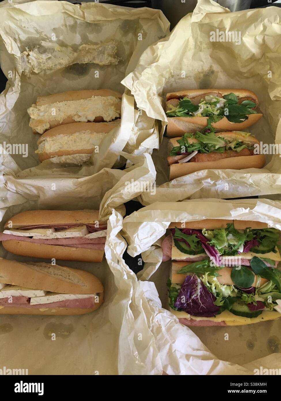 Takeaway lunch during lockdown - assorted filled baguettes Stock Photo