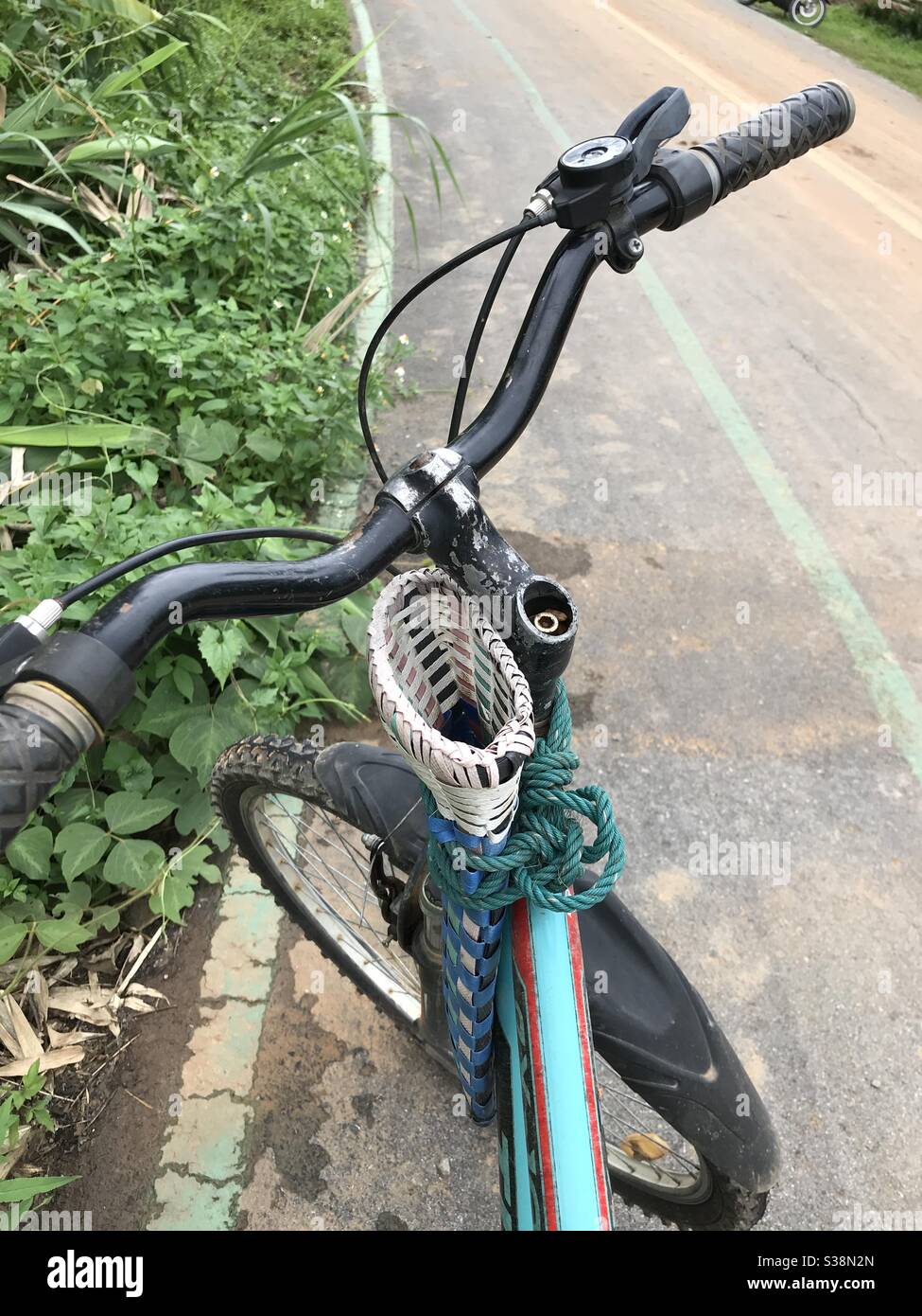 Machete holder on a Thai farmers bike Stock Photo Alamy