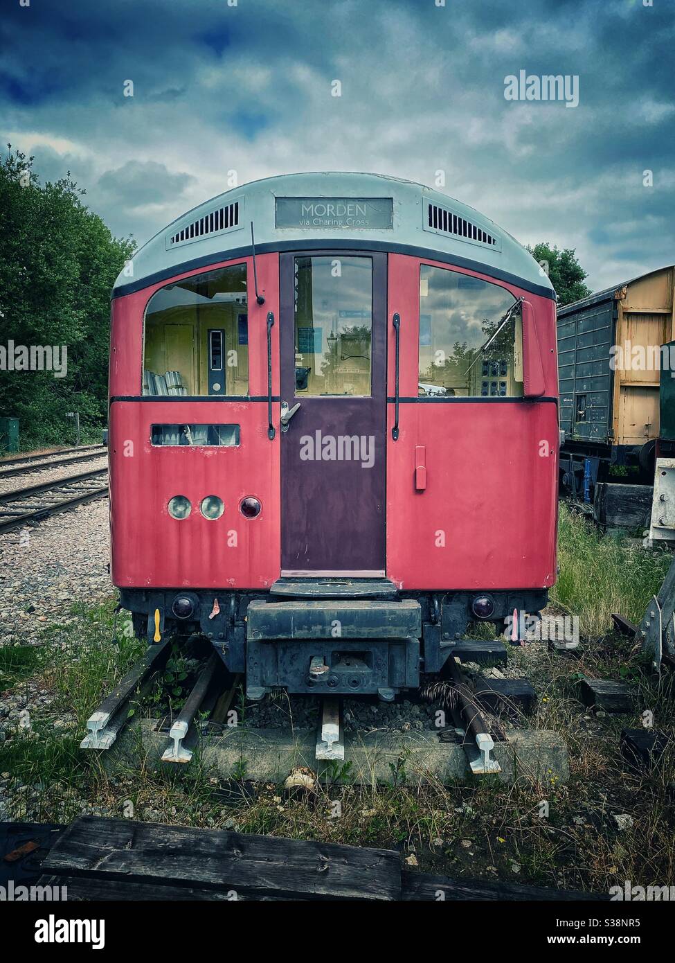Old retired London Underground train from the Northern Line now at end of an old siding in Essex Stock Photo