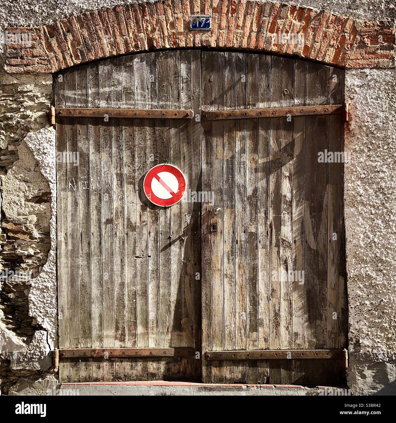 Old weathered garage double doors - Pornic, Loire-Atlantique, France. - Smartphone Captured Stock Image