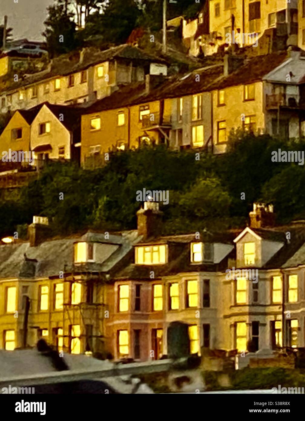 Looe Cornwall sunset light on windows - Smartphone Captured Stock Image