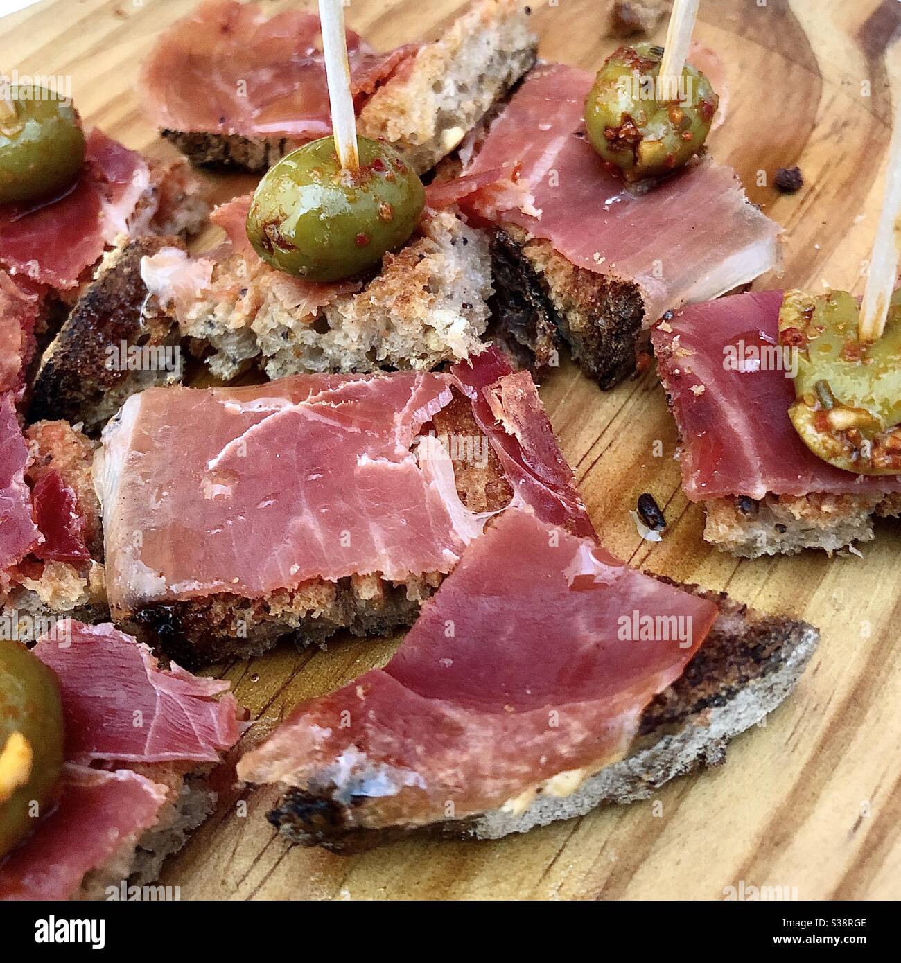 Spanish ham on toasted bread traditional tapas snack. - Smartphone Captured Stock Image
