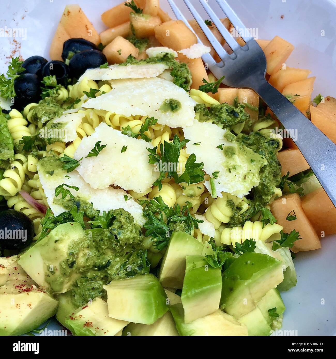 Vegetarian avocado, melon, olives and Parmesan salad. - Smartphone Captured Stock Image