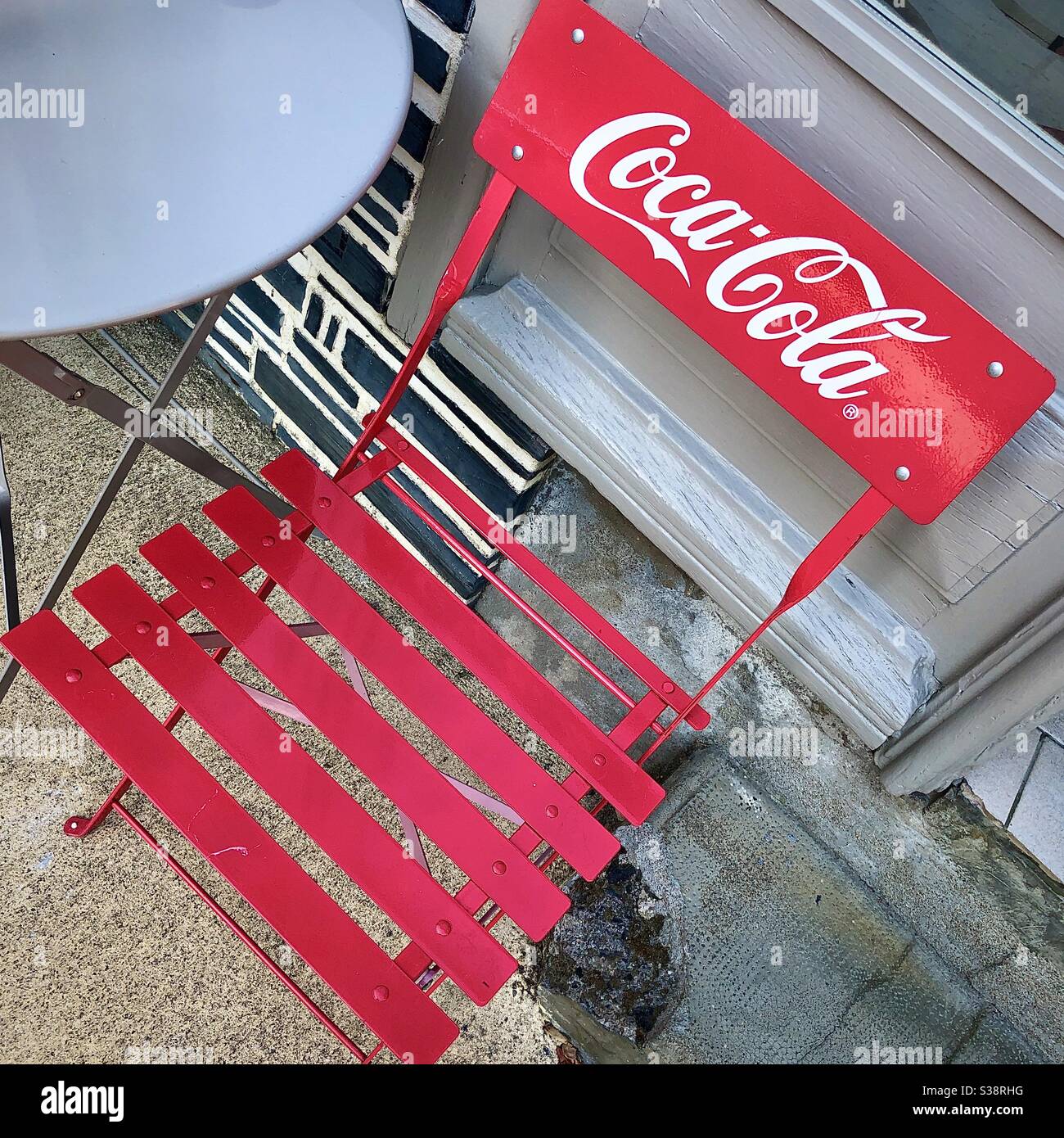 Coca-Cola branded café seat. - Smartphone Captured Stock Image