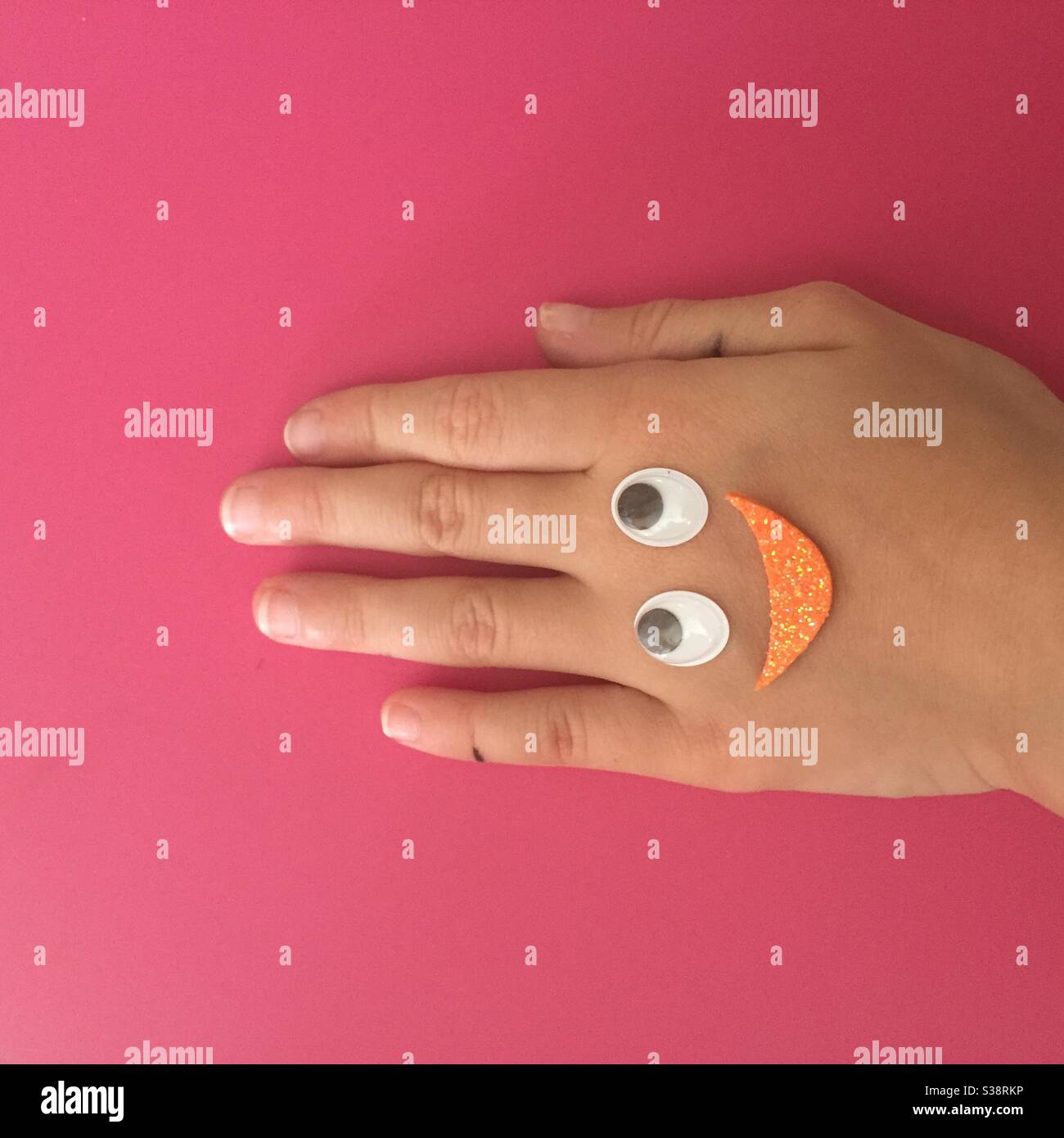 Childs hand with decoration - Smartphone Captured Stock Image