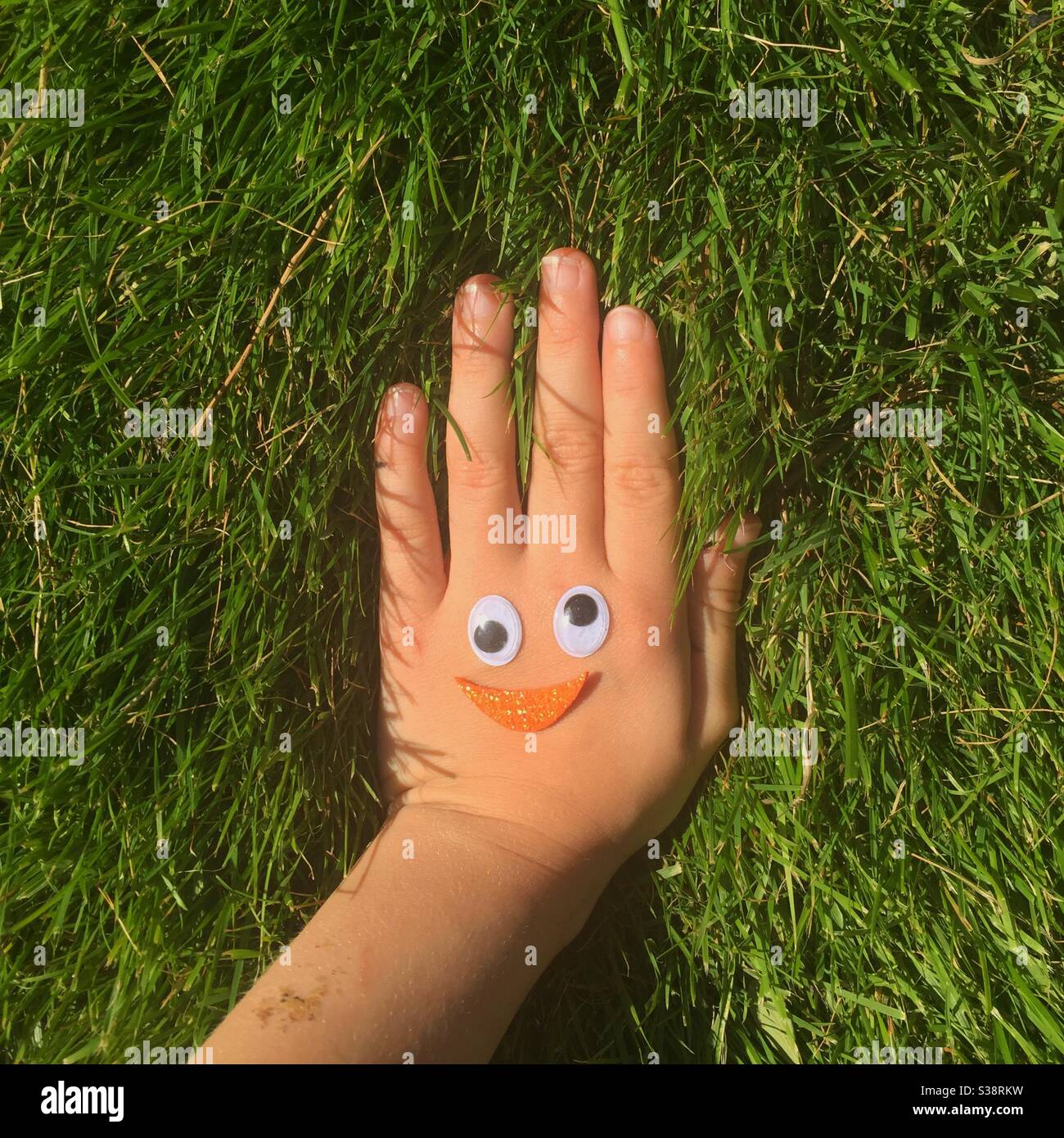 Childs hand with decoration - Smartphone Captured Stock Image