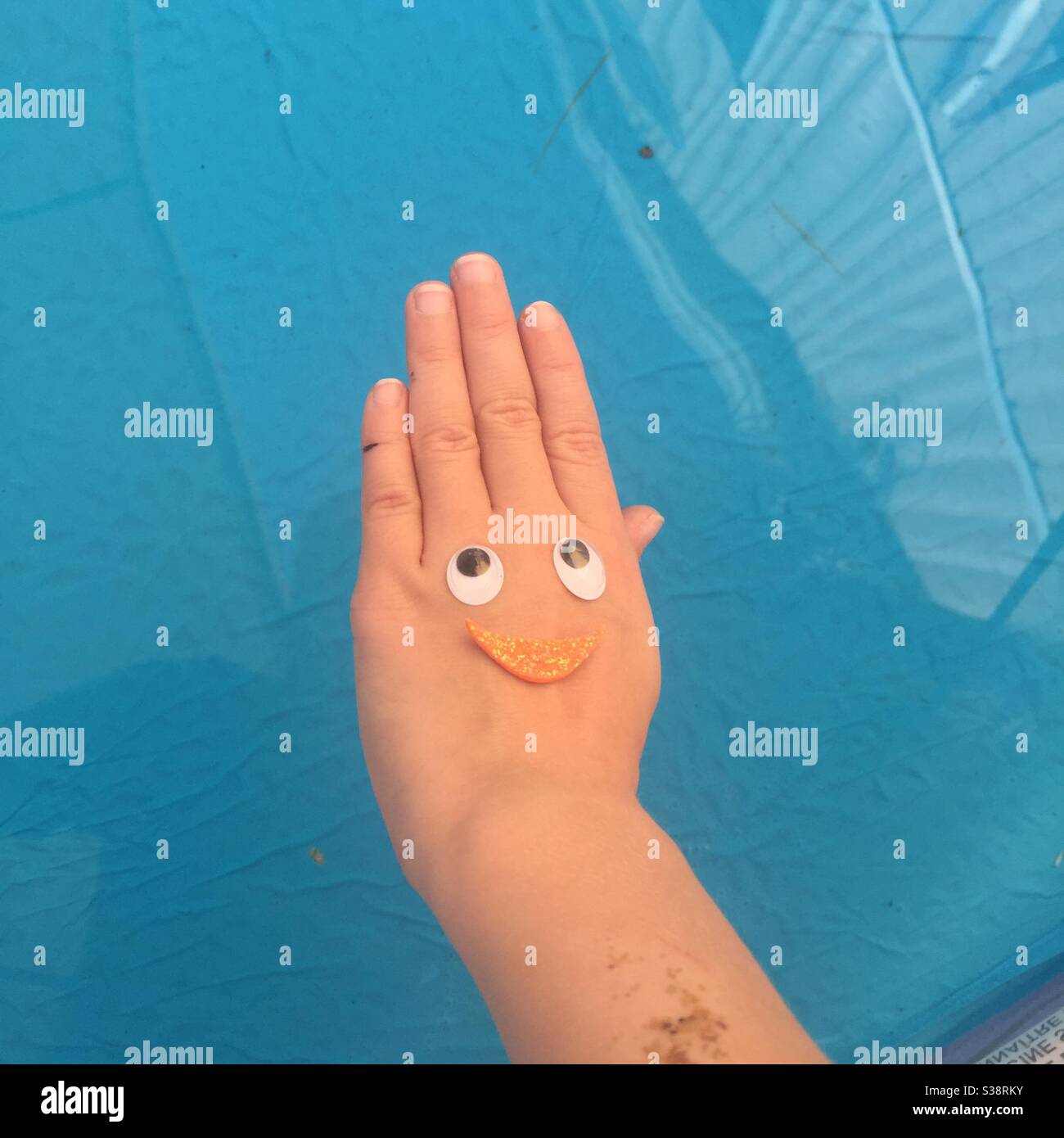 Childs hand with decoration - Smartphone Captured Stock Image