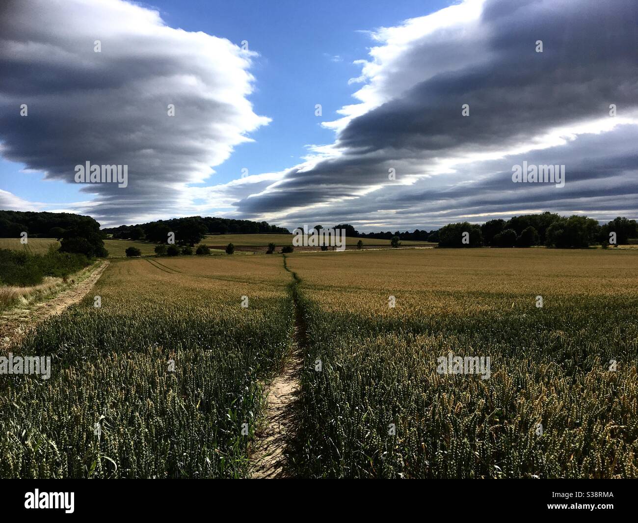 Fantastic cloud formation across a farmland landscape - Smartphone Captured Stock Image