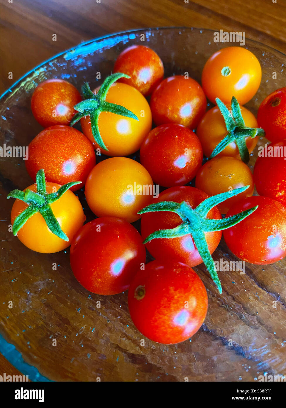 Cherry tomatoes in a glass dish, closeup Stock Photo