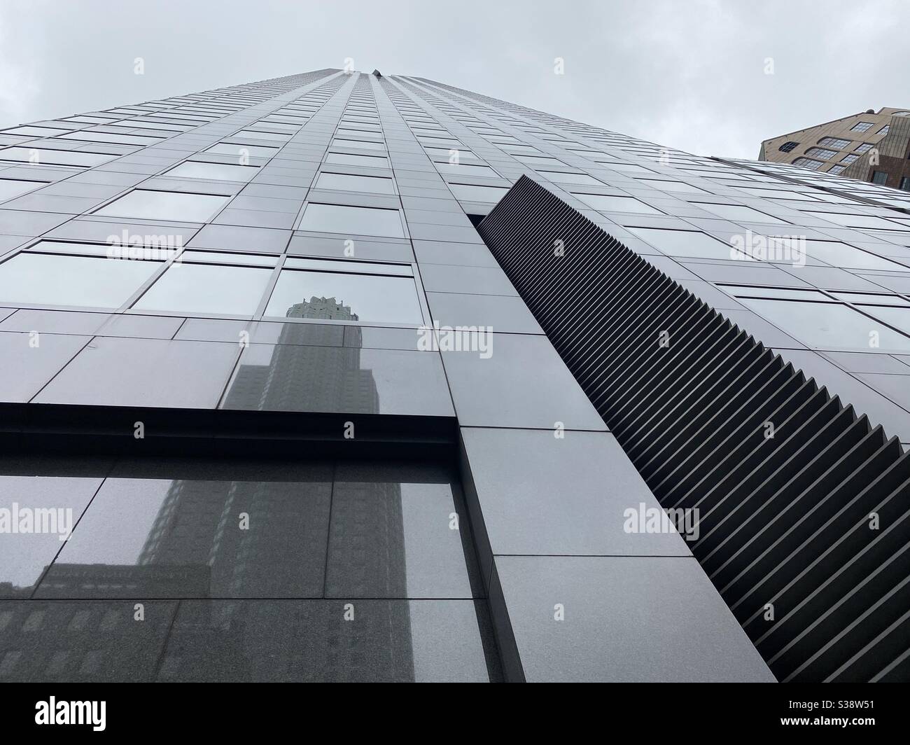 LOS ANGELES, CA, JUN 2020: looking up at the Gas Company Tower with US Bank Tower reflection in Downtown - Smartphone Captured Stock Image