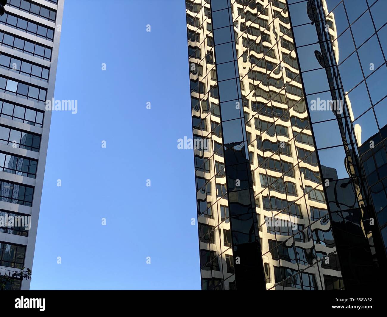 LOS ANGELES, CA, JUN 2020: windows and reflections on tall buildings in Downtown at the intersection of Wilshire Blvd and S Grand Ave - Smartphone Captured Stock Image