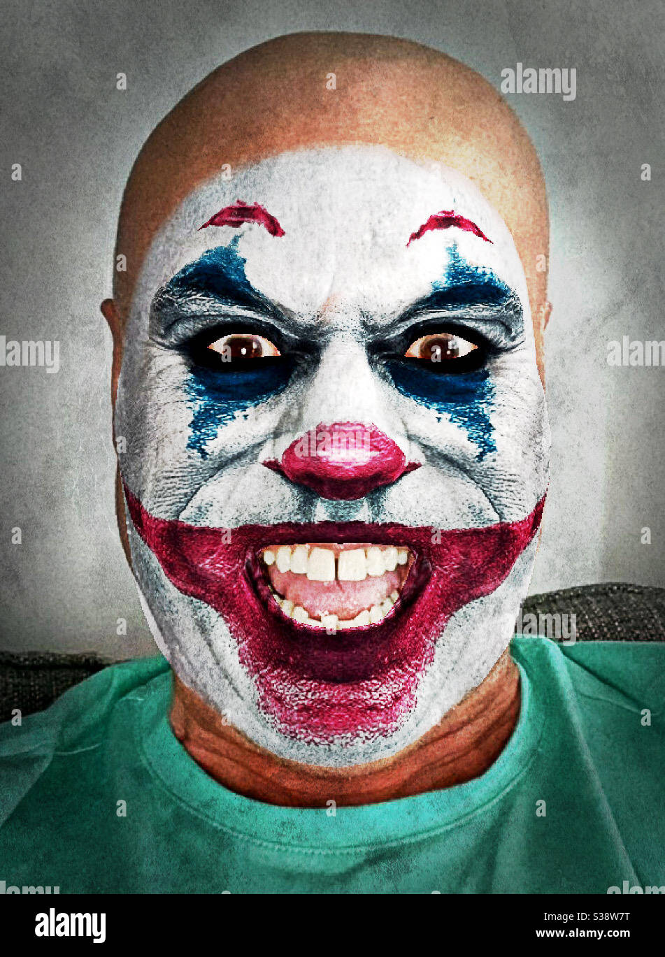 Image of a man modified to look like a sinister clown Stock Photo