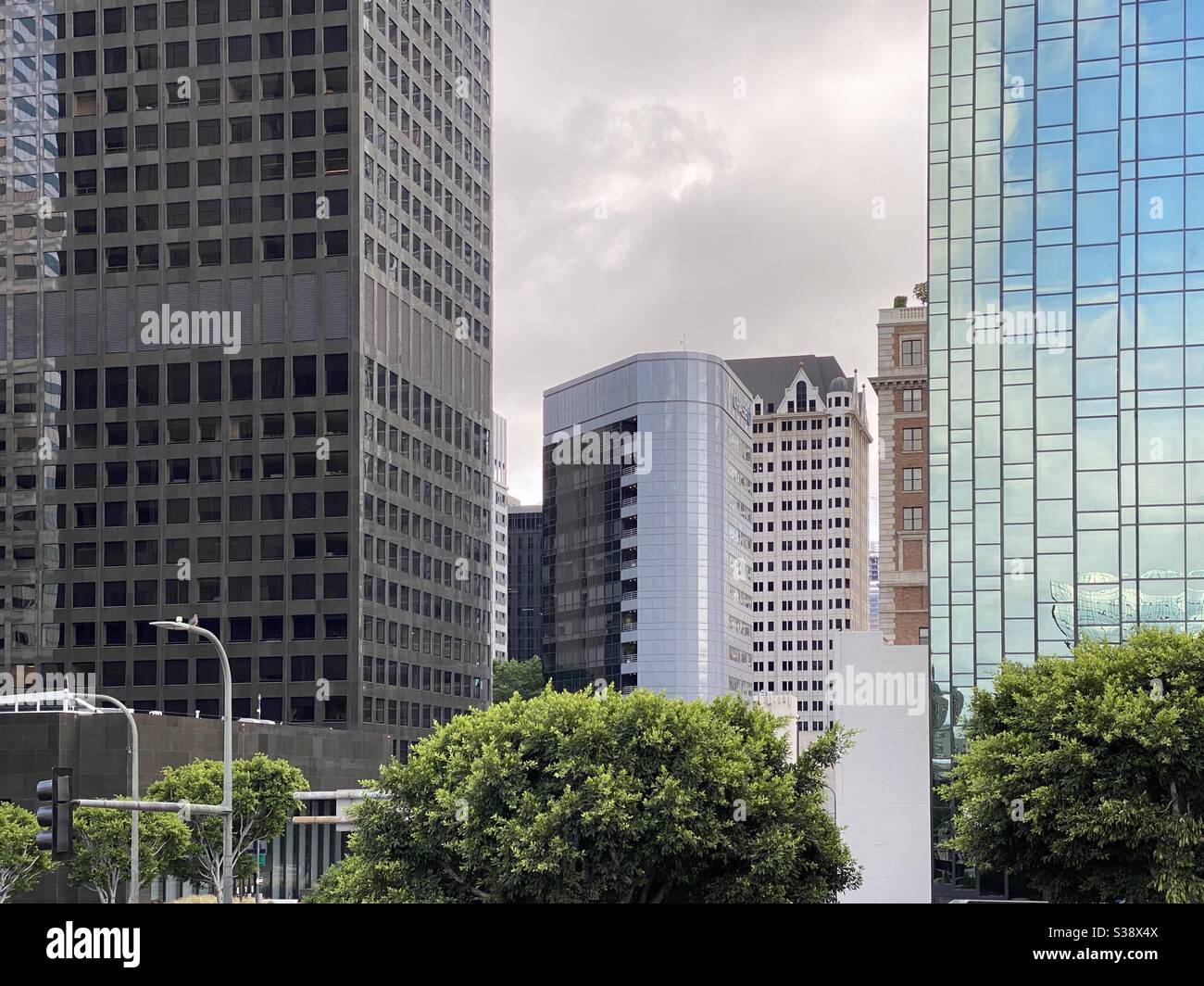 LOS ANGELES, CA, JUN 2020: various tall offices in Downtown with Chase Bank building in the center on overcast day - Smartphone Captured Stock Image