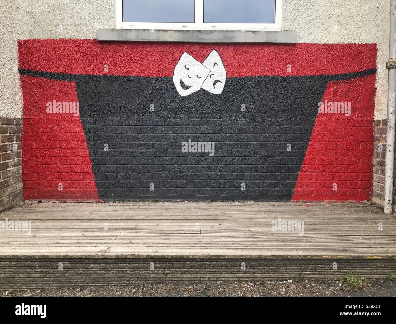 Comedy and Tragedy background mural on an empty stage - Smartphone Captured Stock Image
