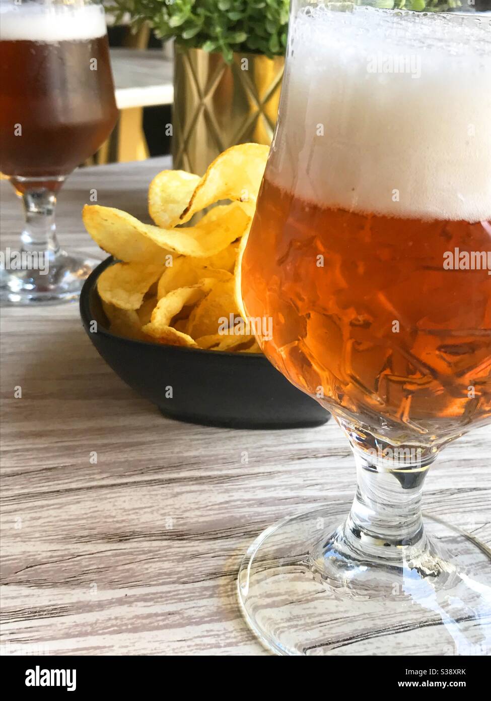 Glass of beer with chips. - Smartphone Captured Stock Image