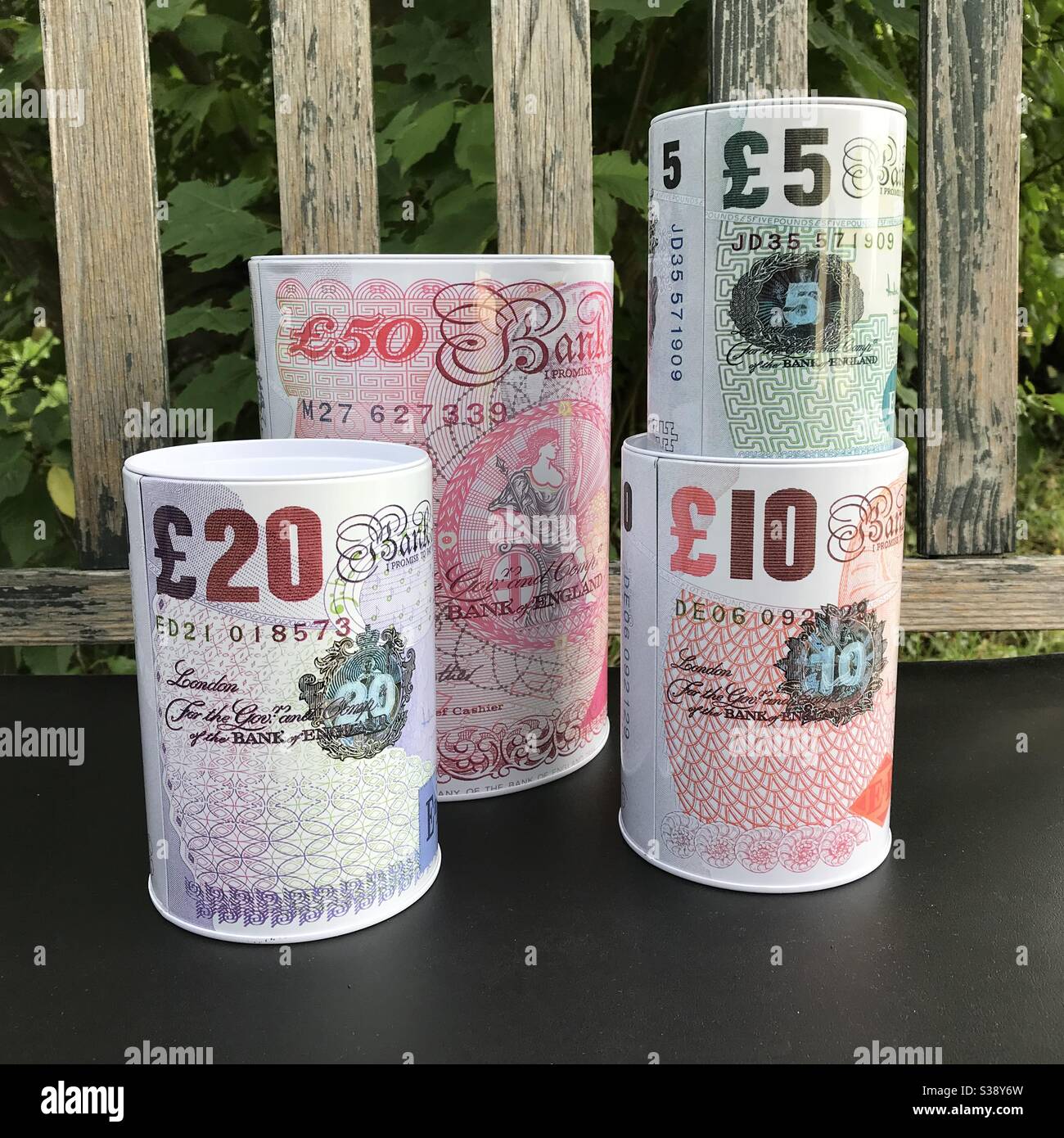 Set of Money Boxes with the Print of Old British Banknotes Stock Photo