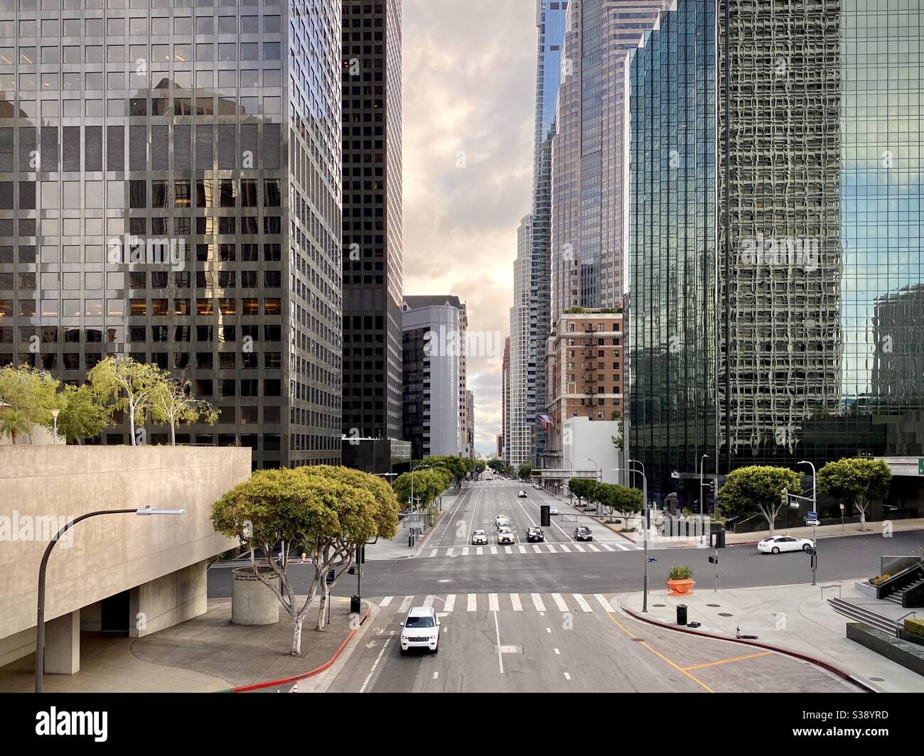 LOS ANGELES, CA, JUN 2020: view south on Flower St in Downtown at magic hour with skyscrapers and offices framing the street - Smartphone Captured Stock Image