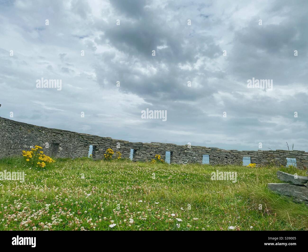 Wall of the ruins of a naval battery at Penrhos Coastal park, Holyhead, Anglesey, north wales - Smartphone Captured Stock Image