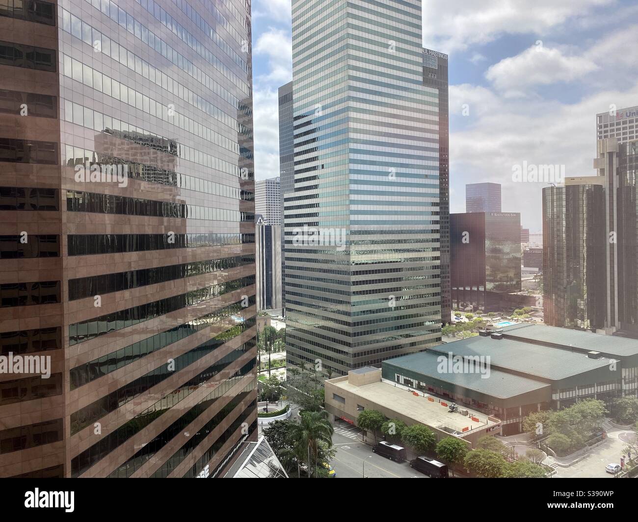 LOS ANGELES, CA, JUN 2020: view looking south west, past skyscrapers in Downtown, YMCA sports complex at bottom right - Smartphone Captured Stock Image