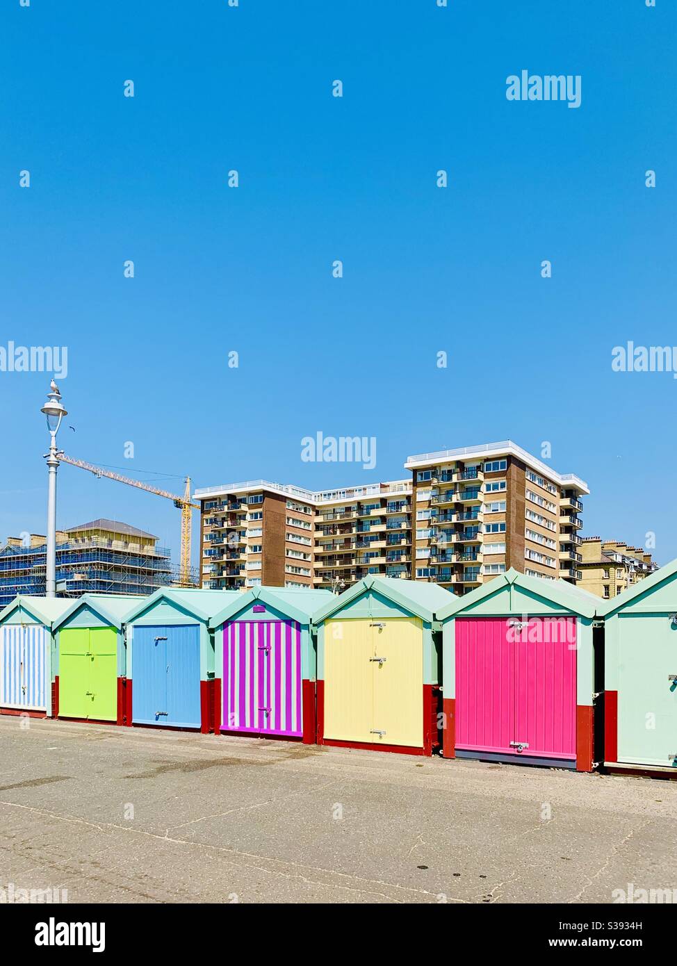 Hove, UK - 11 August 2020: Bright beach huts on the prom in the summer heatwave. - Smartphone Captured Stock Image
