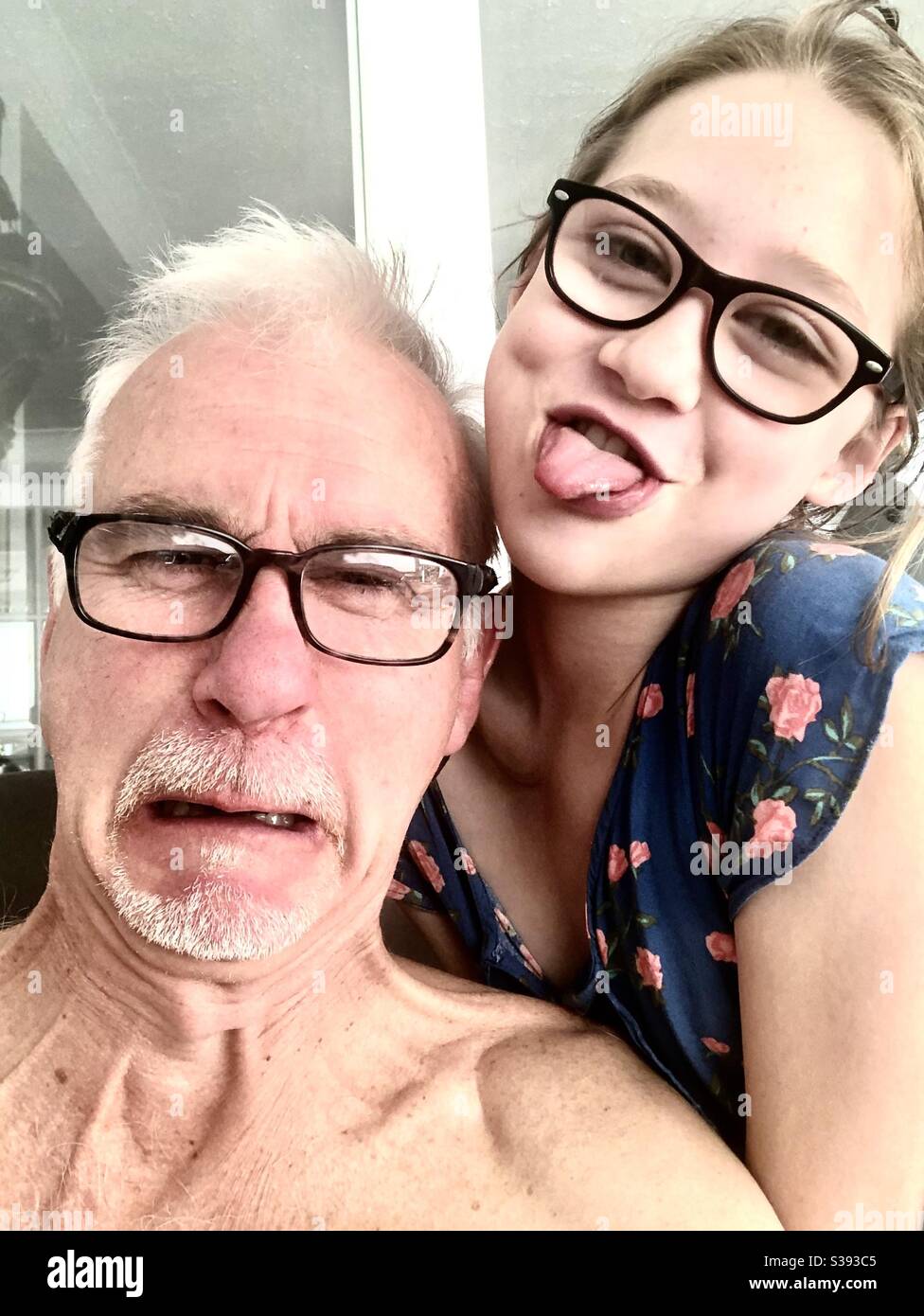 Dad and daughter doing a silly selfie Stock Photo