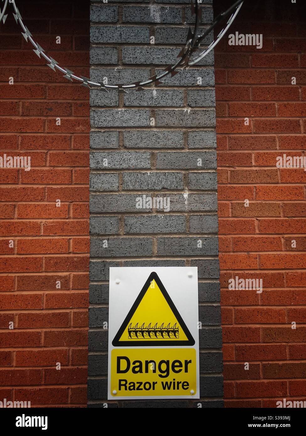 Danger razor wire warning sign - Smartphone Captured Stock Image
