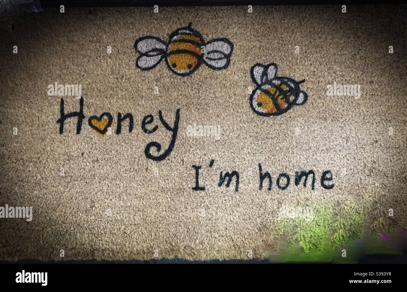 Honey, I’m home, literally and figuratively, with bees and heart icons. Home is where the heart is. Stock Photo