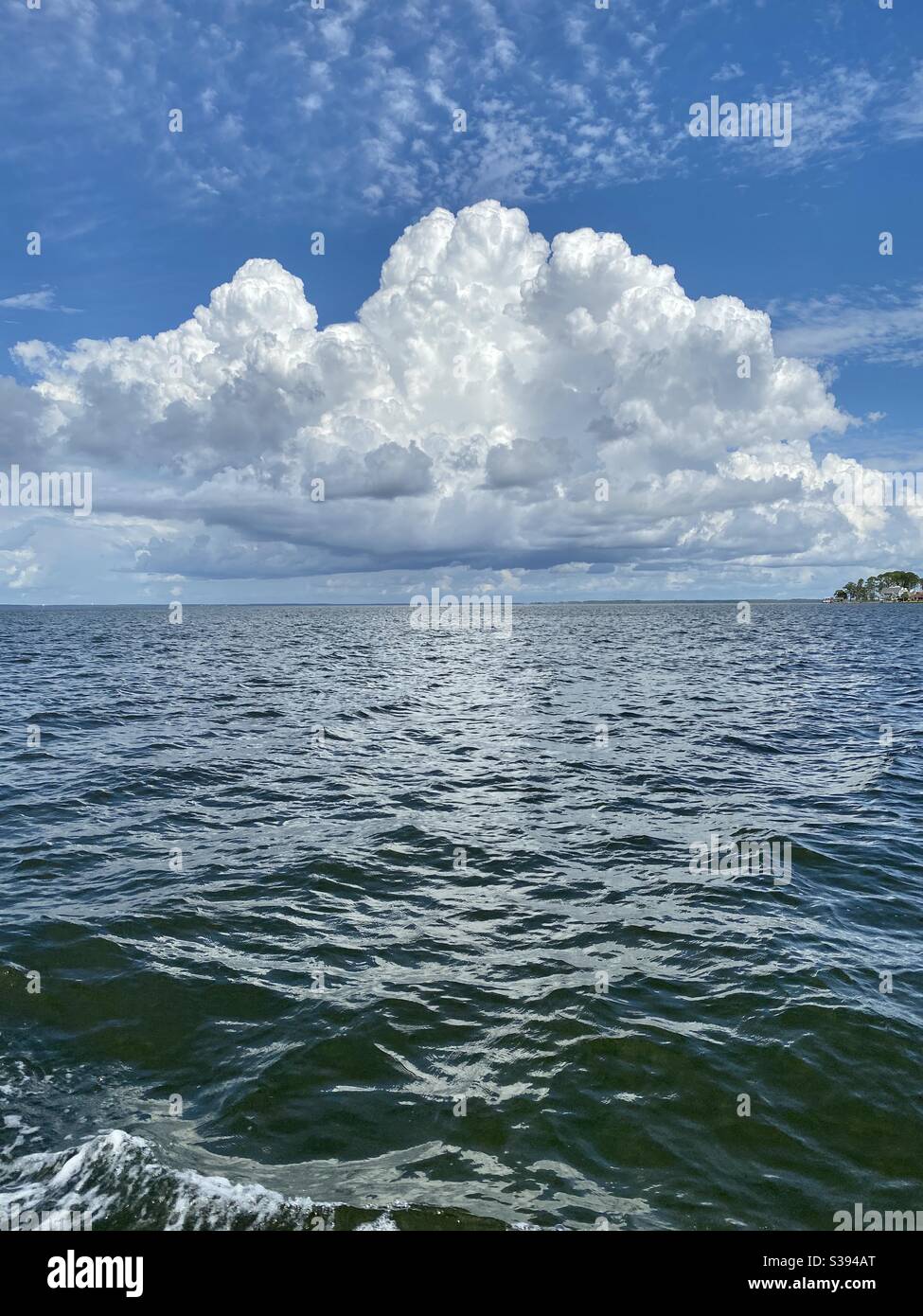 Large white storm cloud formations over the Gulf of Mexico water Florida - Smartphone Captured Stock Image