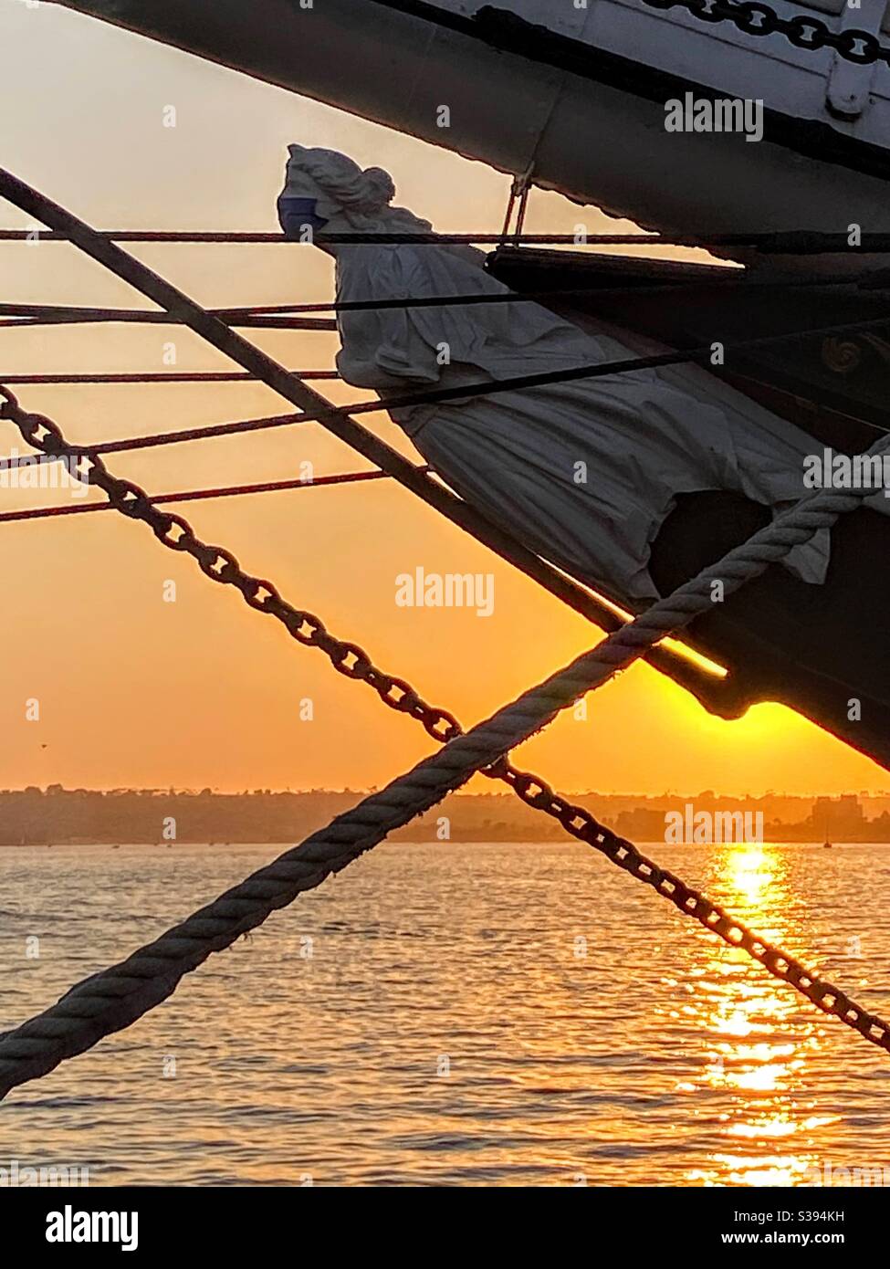 Figurehead of the Star of India wearing protective face mask at sunset on San Diego Harbor Stock Photo