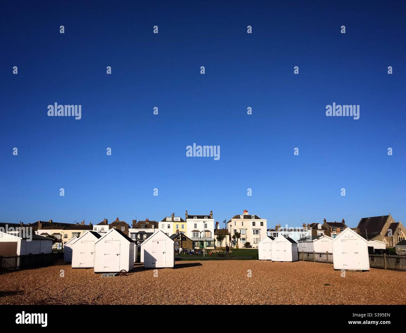 White beach huts at Walmer Deal Kent UK - Smartphone Captured Stock Image