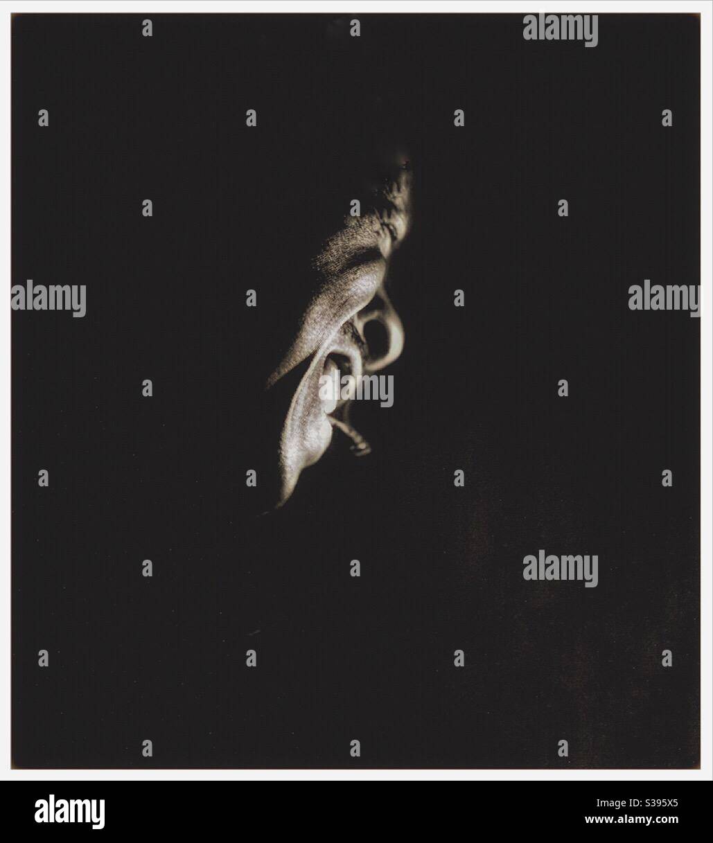 Atmospheric image of a black man smoking - Smartphone Captured Stock Image