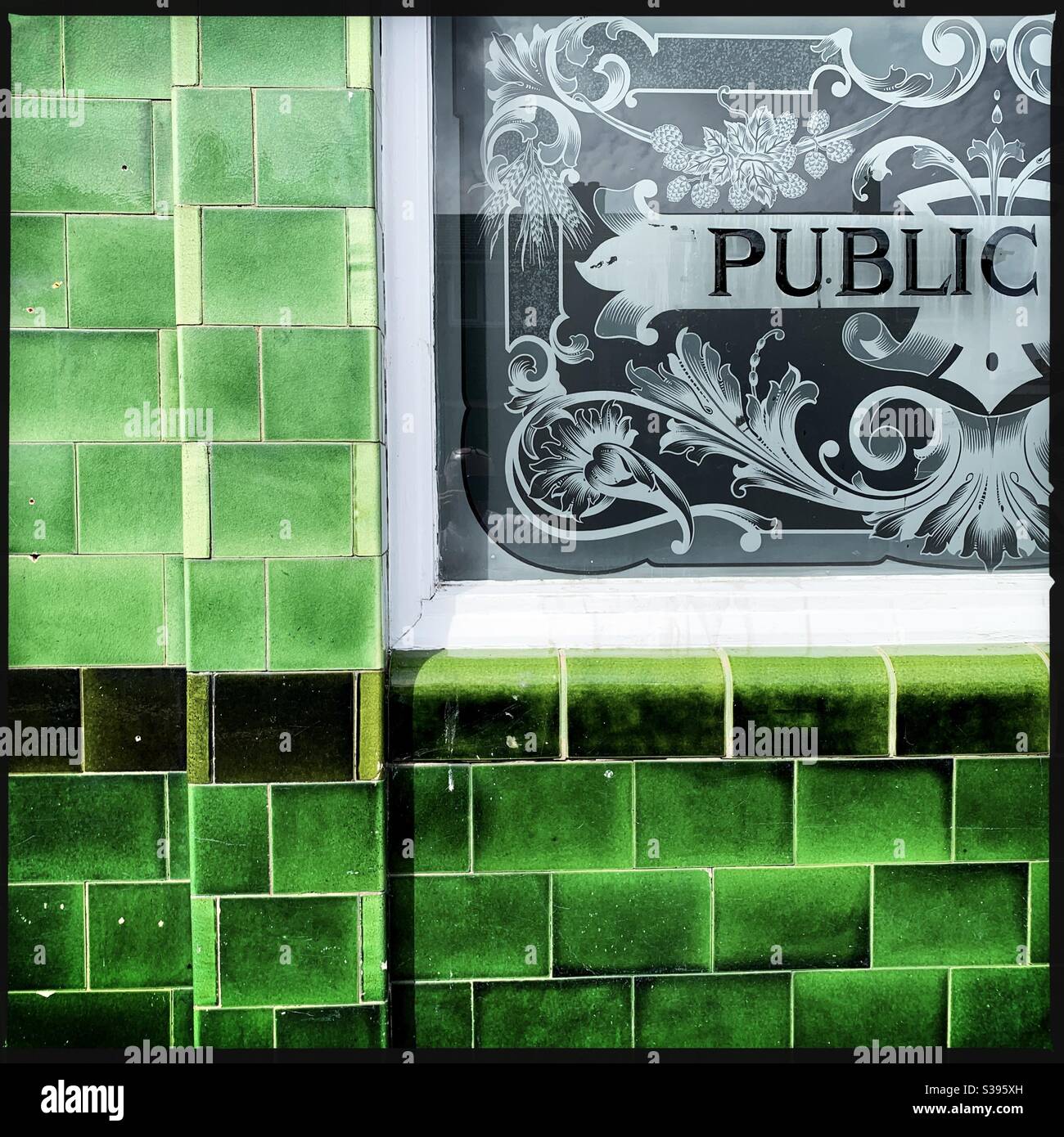 Pub exterior with green tiles Stock Photo