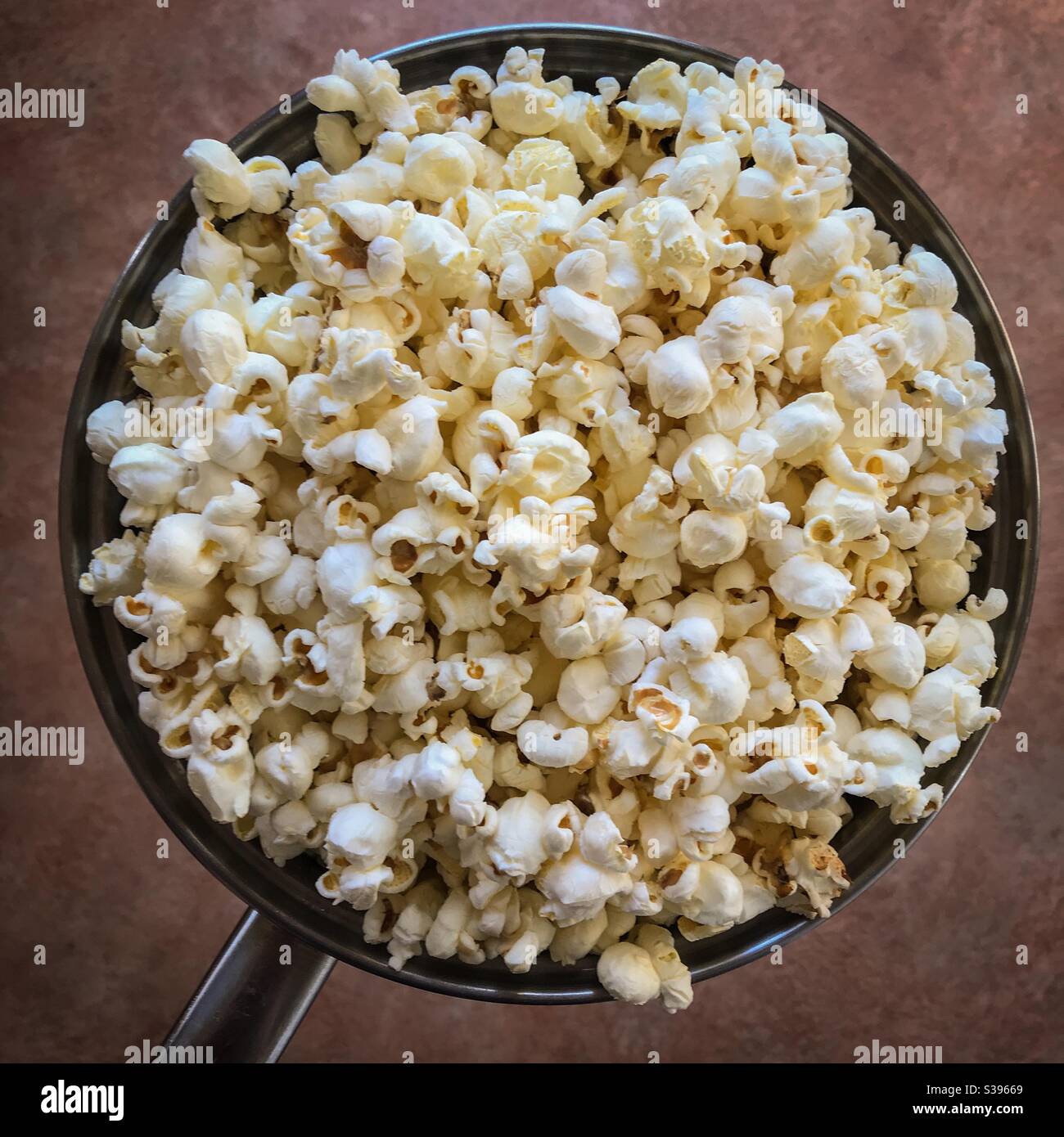 Pot full of popcorn Stock Photo
