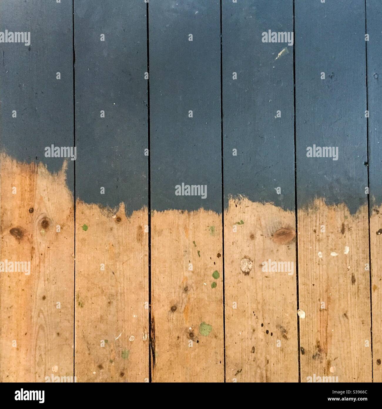Half painted floorboards Stock Photo